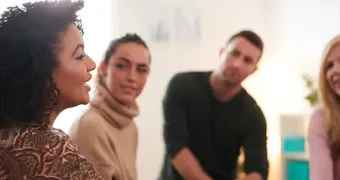 Woman speaking to small group