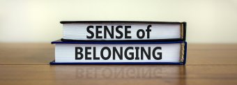 Sense of belonging symbol. Books with words 'sense of belong