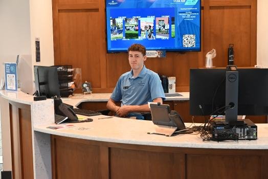 student at front desk